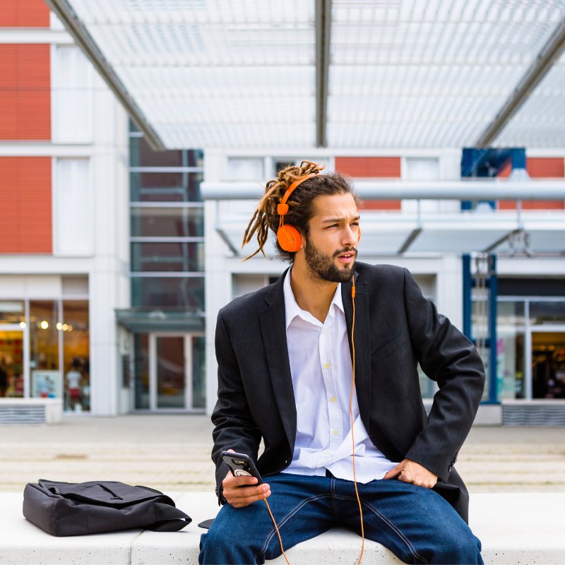 Man With Dreadlocks And Headphones